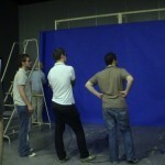 Art Department contemplate blue screen made of paper